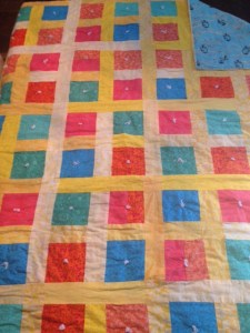 Hello.  It's difficult to tell from these pictures but I am also a reasonably sized quilt.