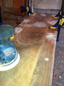 Sanding down the pegs that hold the top in place