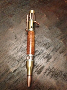 It's a SteamPunk pen!!  The wooden center is made from Australian Red Mallee Burl.  (Value 75$) 