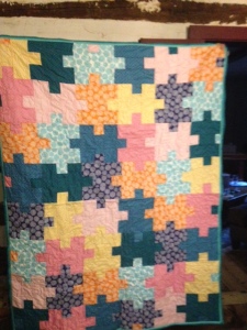 This a new crazy awesome handmade puzzle  quilt from the Frydog Stitch shop.  (Value 200$)